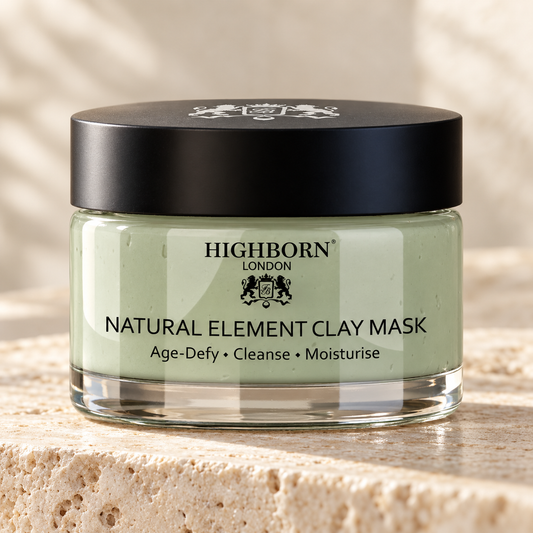 Natural Element Clay Mask jar on warm ivory stone