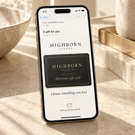 Illustration of a HIGHBORN electronic gift card delivered by email and displayed on a smartphone.
